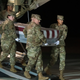 An Air Force carry team moves the transfer case containing the remains of Navy Seaman Apprentice Cameron Scott Walters on Dec. 8, 2019, at Dover Air Force Base. A Saudi gunman killed three people including Walters in a shooting at Naval Air Station Pensacola in Florida.